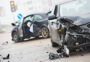car crash accident on street, damaged automobiles after collision in city